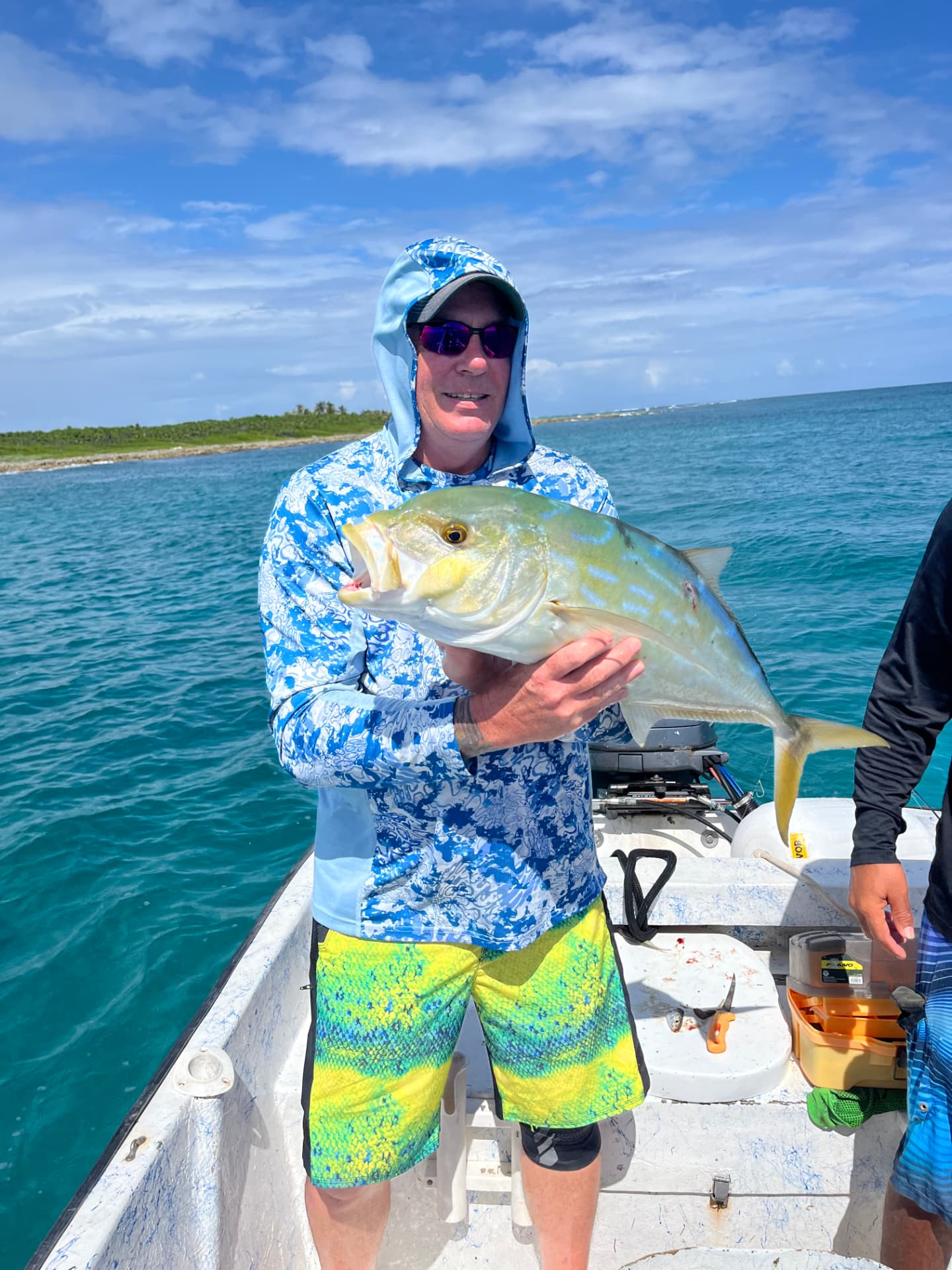 Guest with a bright jack caught near the reef channel
