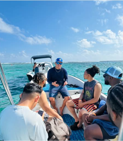 Captain briefing a group of guests on board before snorkeling
