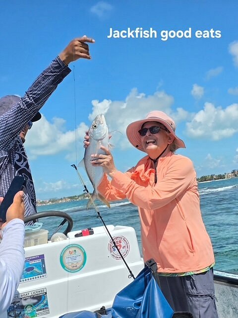 Guest holding up a jackfish caught off Ambergris Caye